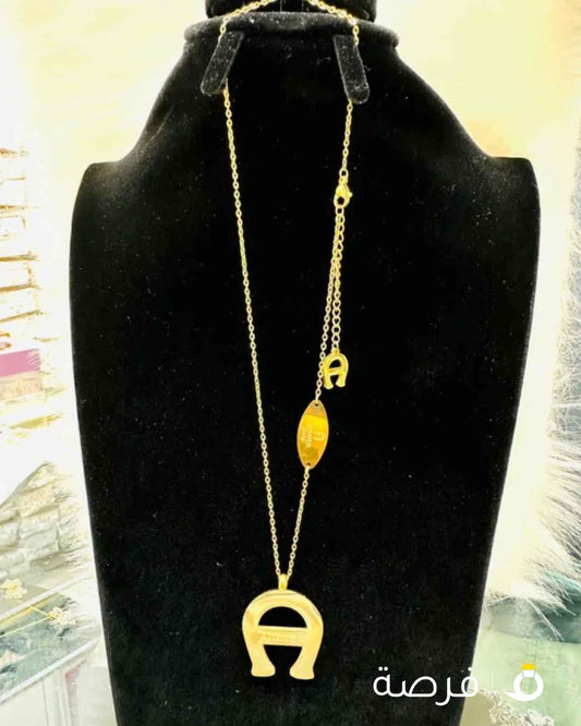 قلادة ماركة اقنر مطلي ذهب